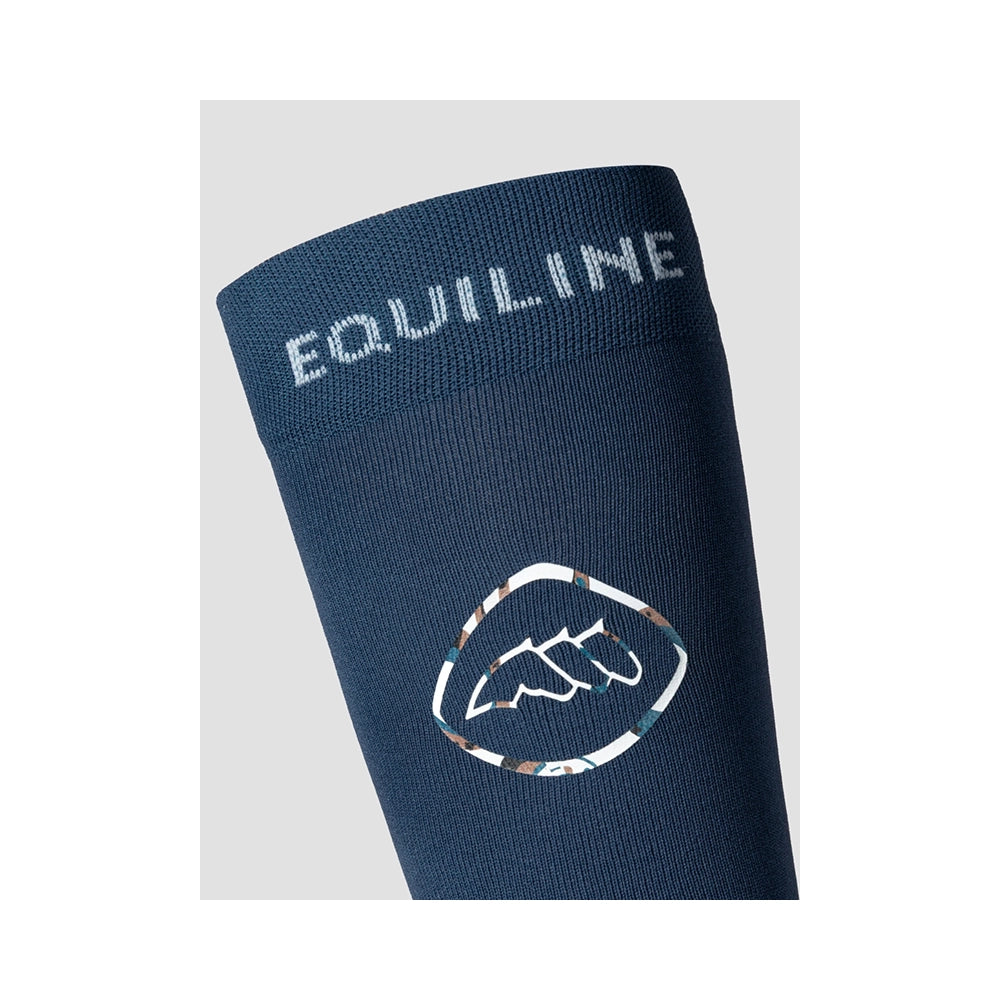 Ratsastussukkien Equiline Eqeprit -logo ja tekninen istuvuus, kevyet sukat ratsastussaappaan alle